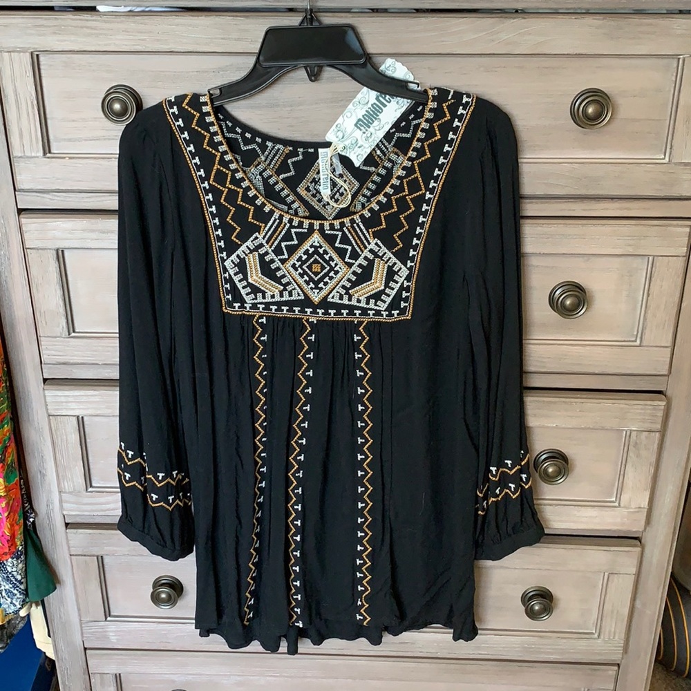 Pretty top with gorgeous embroidery NWT in size M.